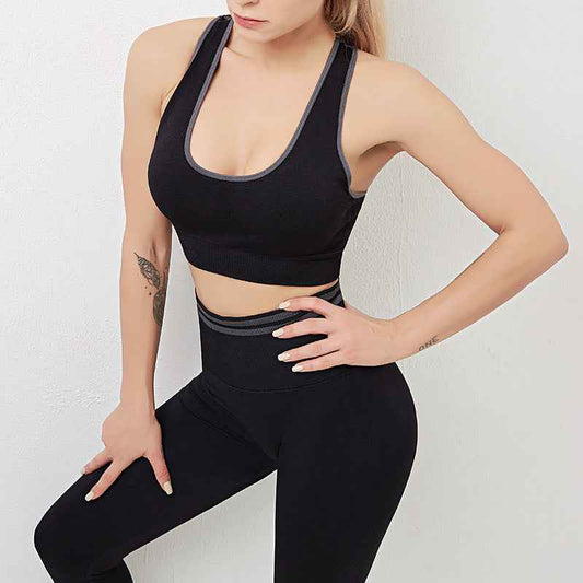 Women's Seamless Sports Bra & High-Waist Leggings Gym Set shown on model — black colour, round neck sports bra, high-waist seamless leggings, contrast trim — Fifi London Spring collection