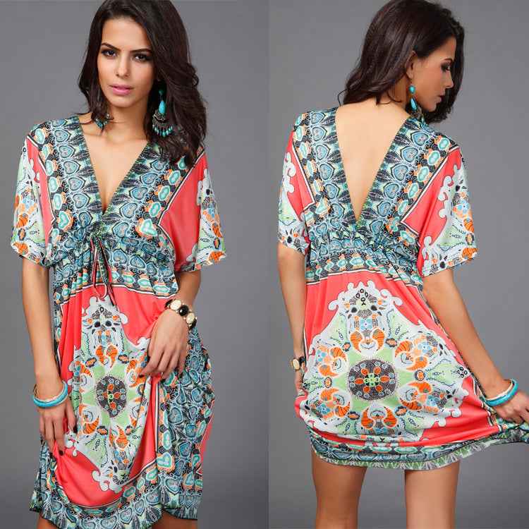 Women's Boho Tribal Print V-Neck Mini Dress shown front-on on model with batwing sleeves and adjustable waist tie — Fifi London summer collection