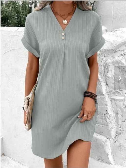 Women's V-Neck Short Sleeve Casual Dress shown front-on on model with button detail — green vertical stripe mini dress, Fifi London collection