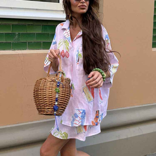 Women's Printed V-Neck Sleeveless Maxi Dress shown front-on on model with polka dot print and side slit — large swing party dress, Fifi London collection