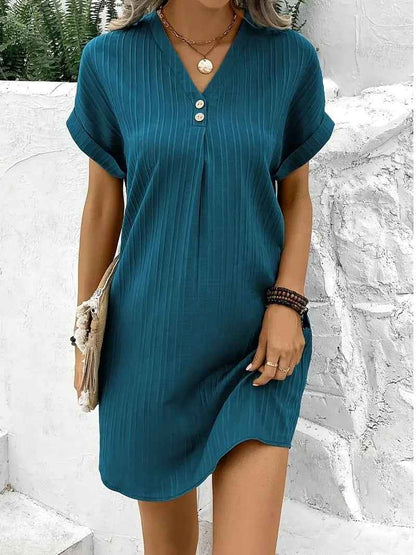 Women's V-Neck Short Sleeve Casual Dress shown front-on on model with button detail — green vertical stripe mini dress, Fifi London collection