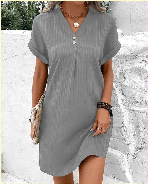 Women's V-Neck Short Sleeve Casual Dress shown front-on on model with button detail — green vertical stripe mini dress, Fifi London collection