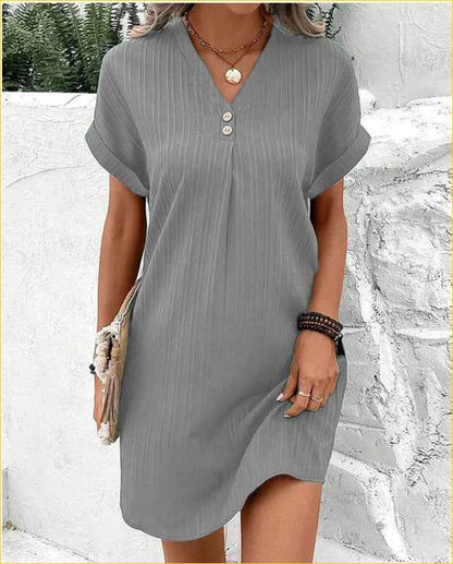 Women's V-Neck Short Sleeve Casual Dress shown front-on on model with button detail — green vertical stripe mini dress, Fifi London collection