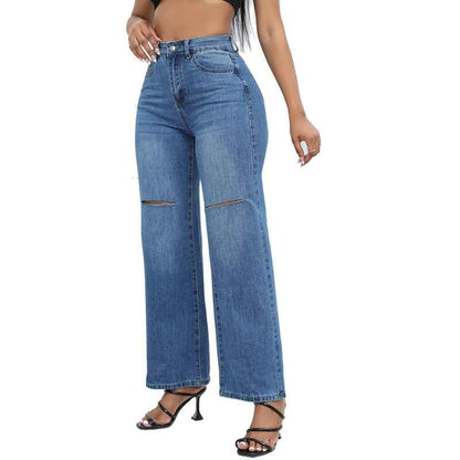 Elegant Ripped Denim Trousers shown front-on on model — Fifi London Autumn collection