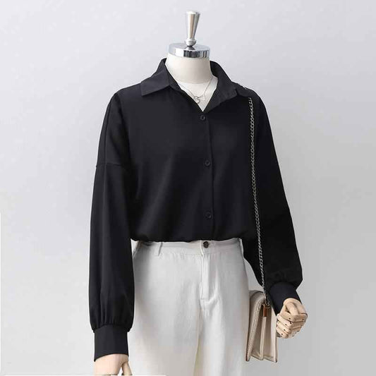 Women's Loose Long Sleeve Lapel Shirt shown front-on on mannequin — white solid colour, button front, voluminous sleeves — Fifi London Autumn collection
