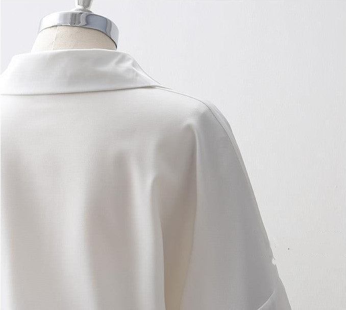 Women's Loose Long Sleeve Lapel Shirt shown front-on on mannequin — white solid colour, button front, voluminous sleeves — Fifi London Autumn collection