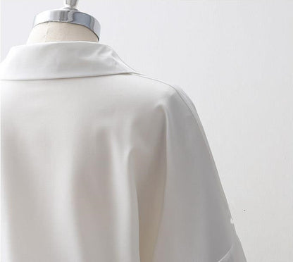 Women's Loose Long Sleeve Lapel Shirt shown front-on on mannequin — white solid colour, button front, voluminous sleeves — Fifi London Autumn collection