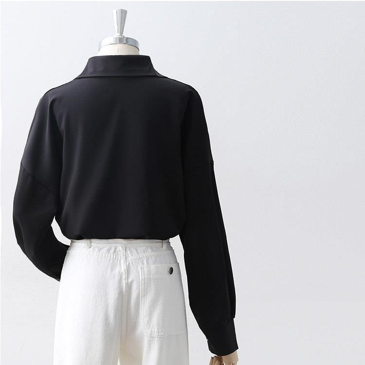 Women's Loose Long Sleeve Lapel Shirt shown front-on on mannequin — white solid colour, button front, voluminous sleeves — Fifi London Autumn collection