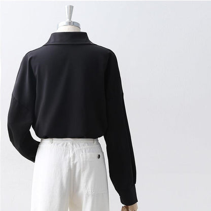 Women's Loose Long Sleeve Lapel Shirt shown front-on on mannequin — white solid colour, button front, voluminous sleeves — Fifi London Autumn collection