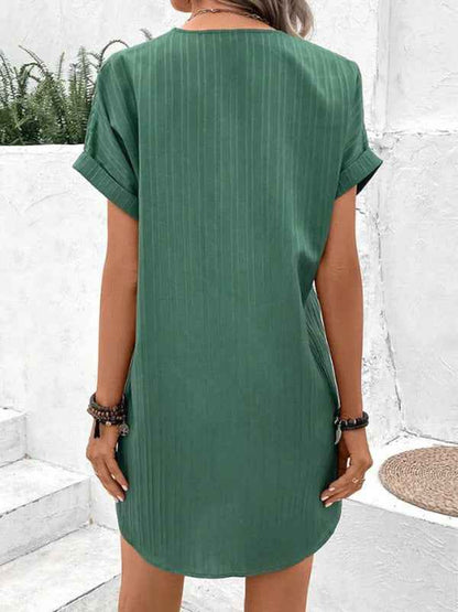 Women's V-Neck Short Sleeve Casual Dress shown front-on on model with button detail — green vertical stripe mini dress, Fifi London collection
