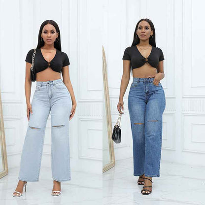 Elegant Ripped Denim Trousers shown front-on on model — Fifi London Autumn collection